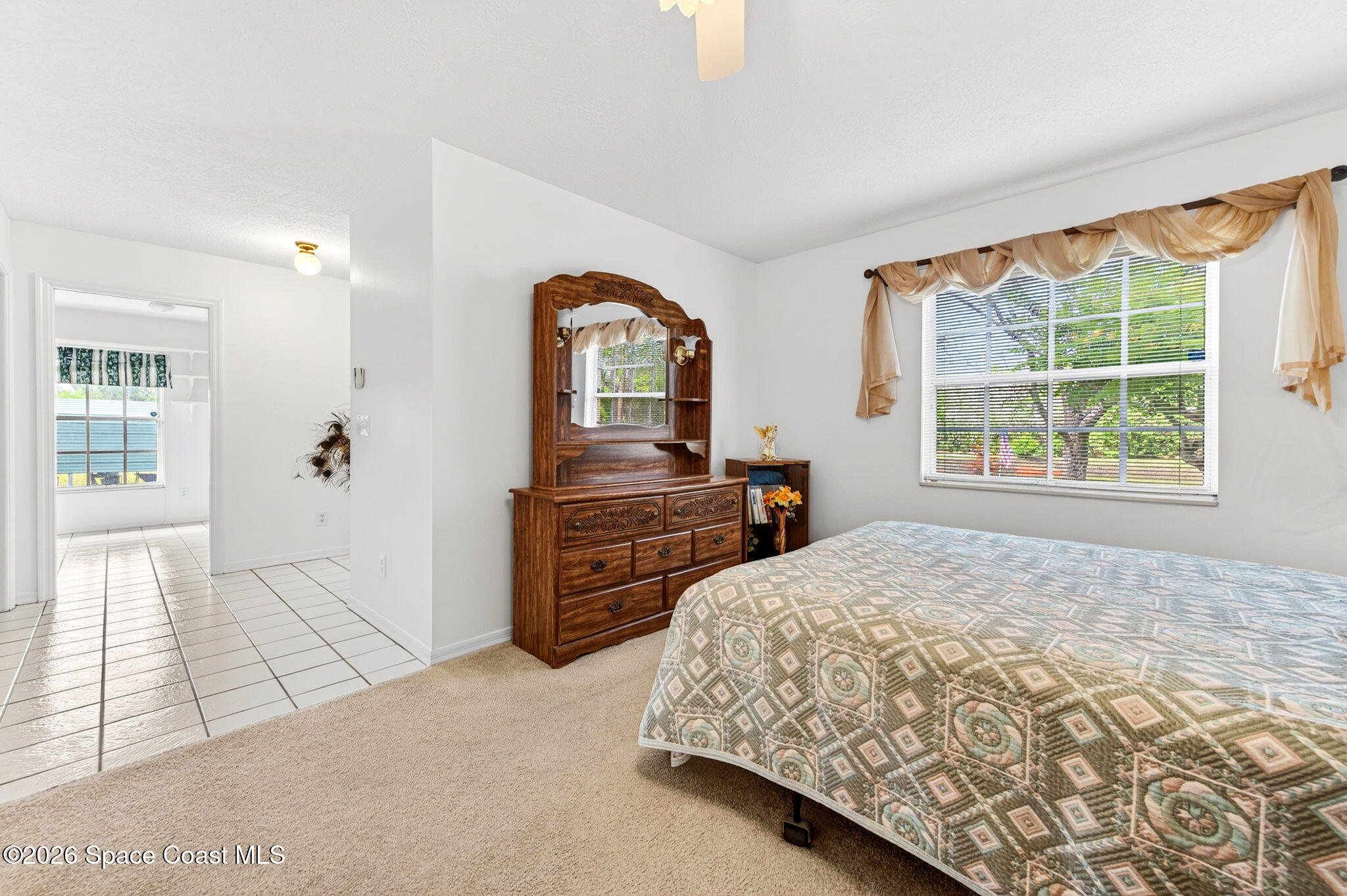 1455 Atz Road Malabar, FL 32950 - Photo 41 of 72 a bedroom with a bed and a dresser