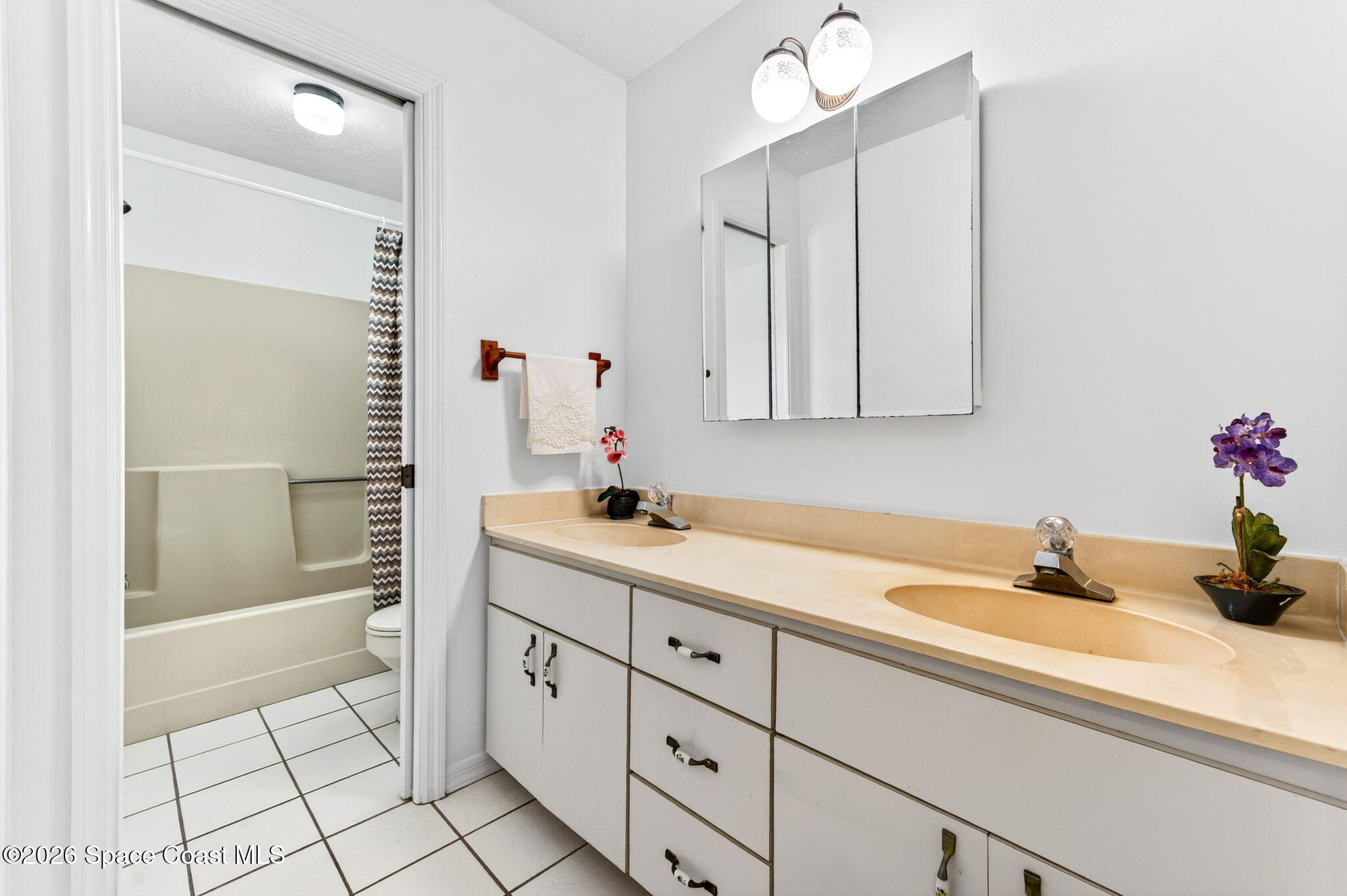 1455 Atz Road Malabar, FL 32950 - Photo 44 of 72 a bathroom with a sink a toilet and shower