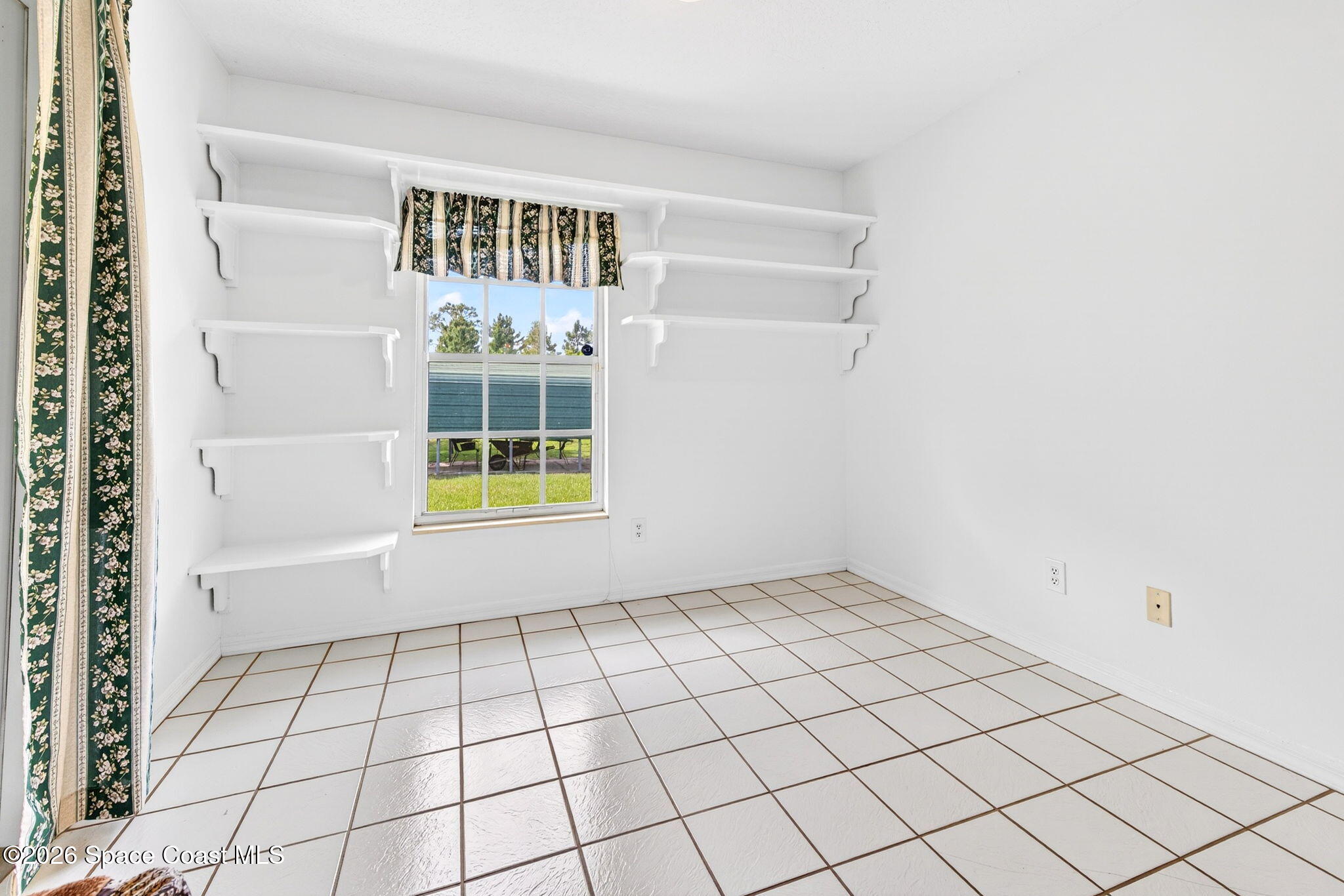 1455 Atz Road Malabar, FL 32950 - Photo 46 of 73 a view of an empty room and window