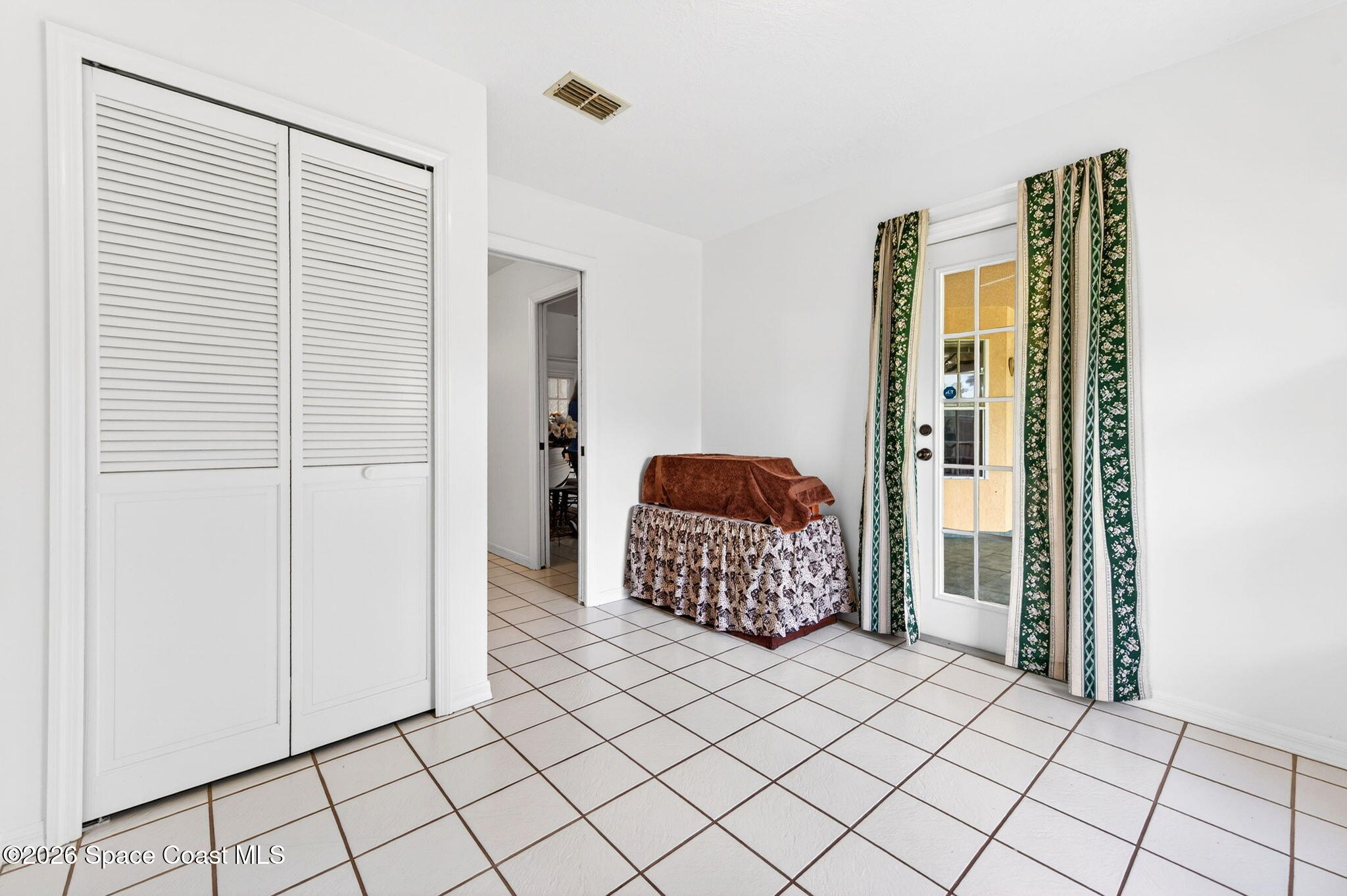 1455 Atz Road Malabar, FL 32950 - Photo 47 of 73 a bedroom with a bed and a window