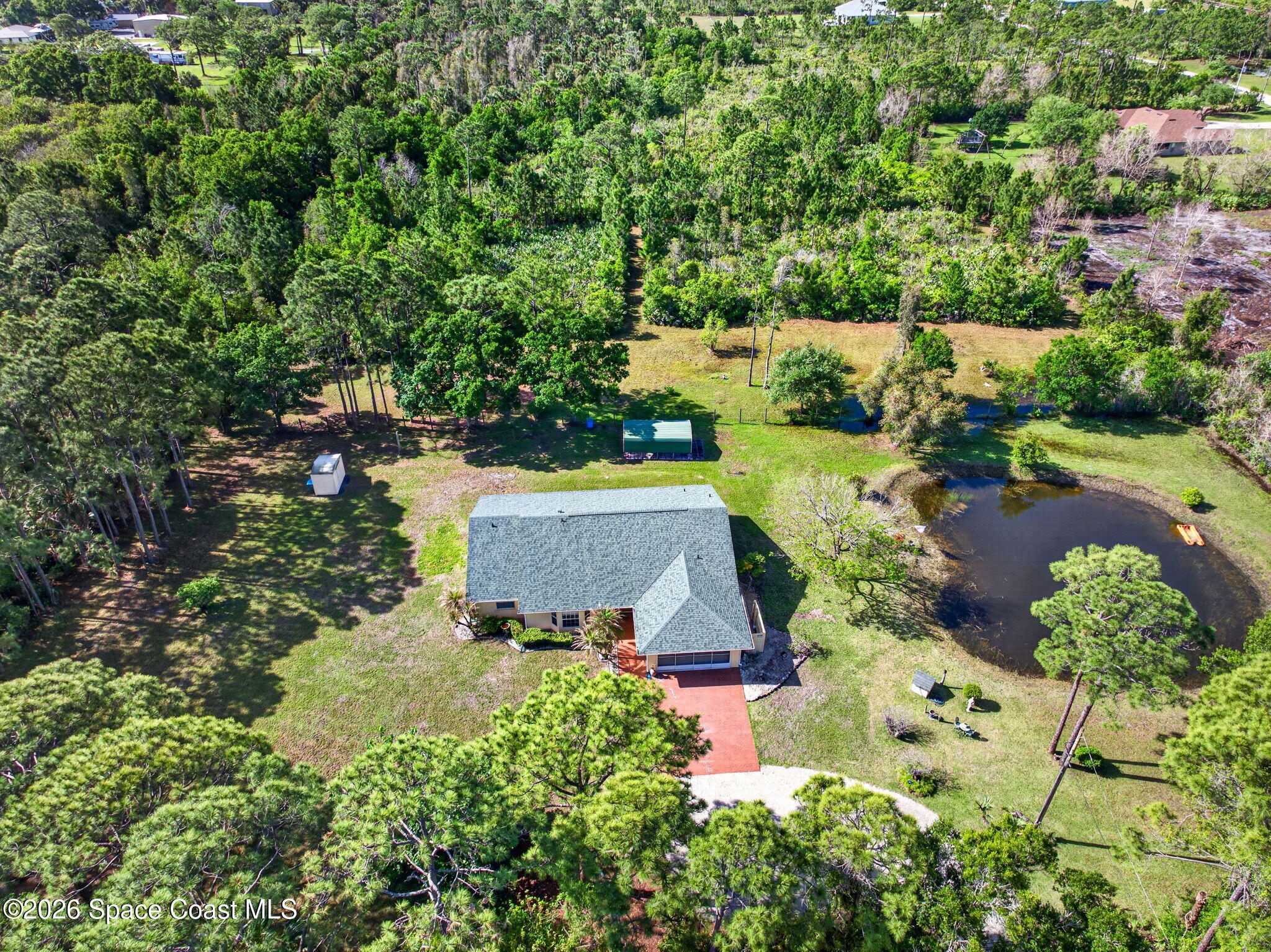1455 Atz Road Malabar, FL 32950 - Photo 5 of 72 an aerial view of a house with yard swimming pool and outdoor seating