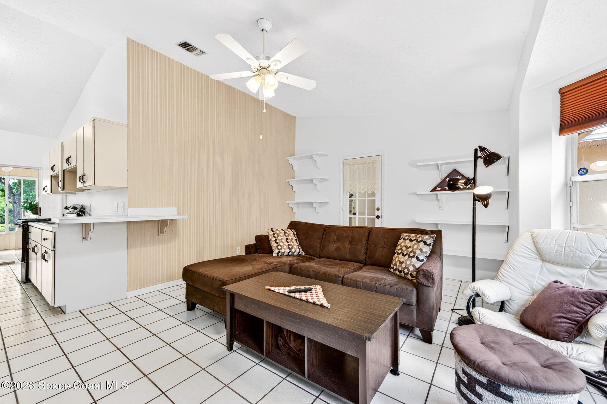 1455 Atz Road Malabar, FL 32950 - Photo 52 of 72 a living room with furniture and a chandelier