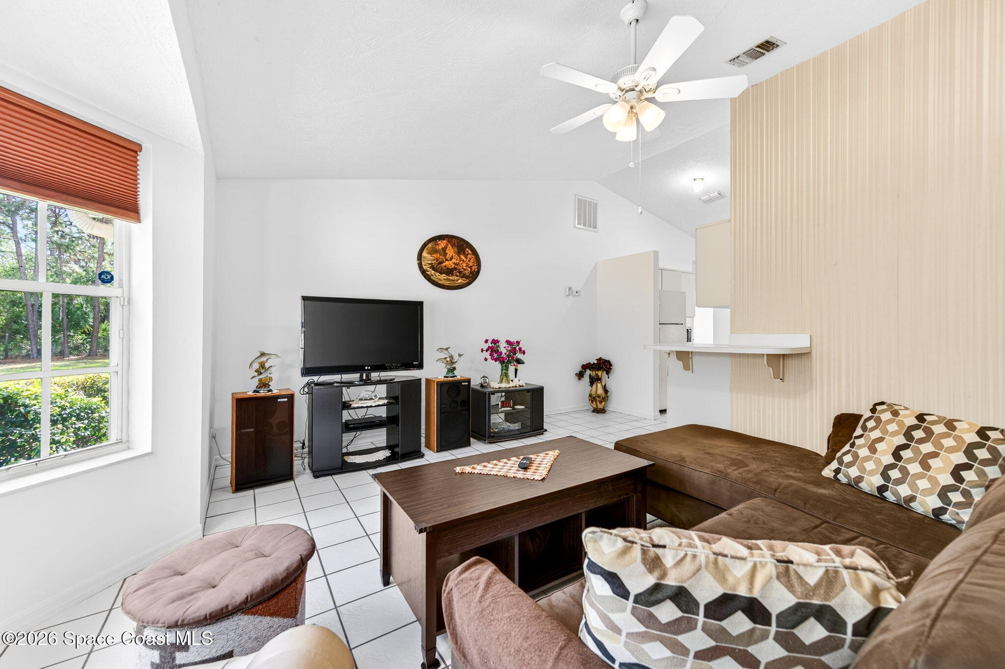 1455 Atz Road Malabar, FL 32950 - Photo 54 of 72 a living room with furniture and a flat screen tv