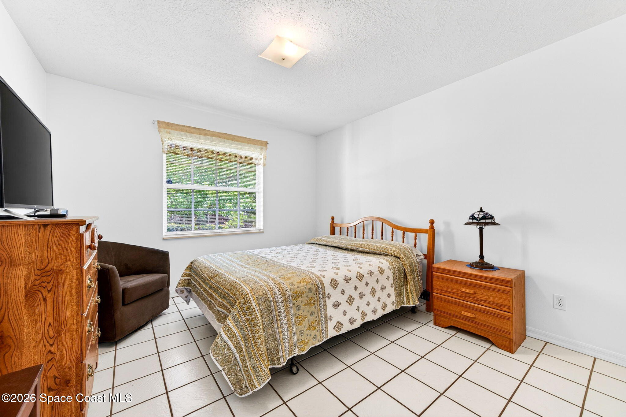 1455 Atz Road Malabar, FL 32950 - Photo 56 of 73 a bedroom with a bed and a window