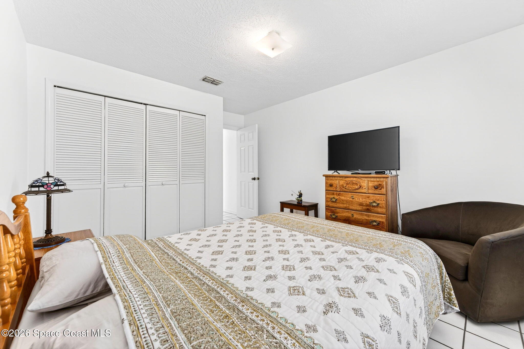 1455 Atz Road Malabar, FL 32950 - Photo 57 of 73 a bedroom with a bed and a television