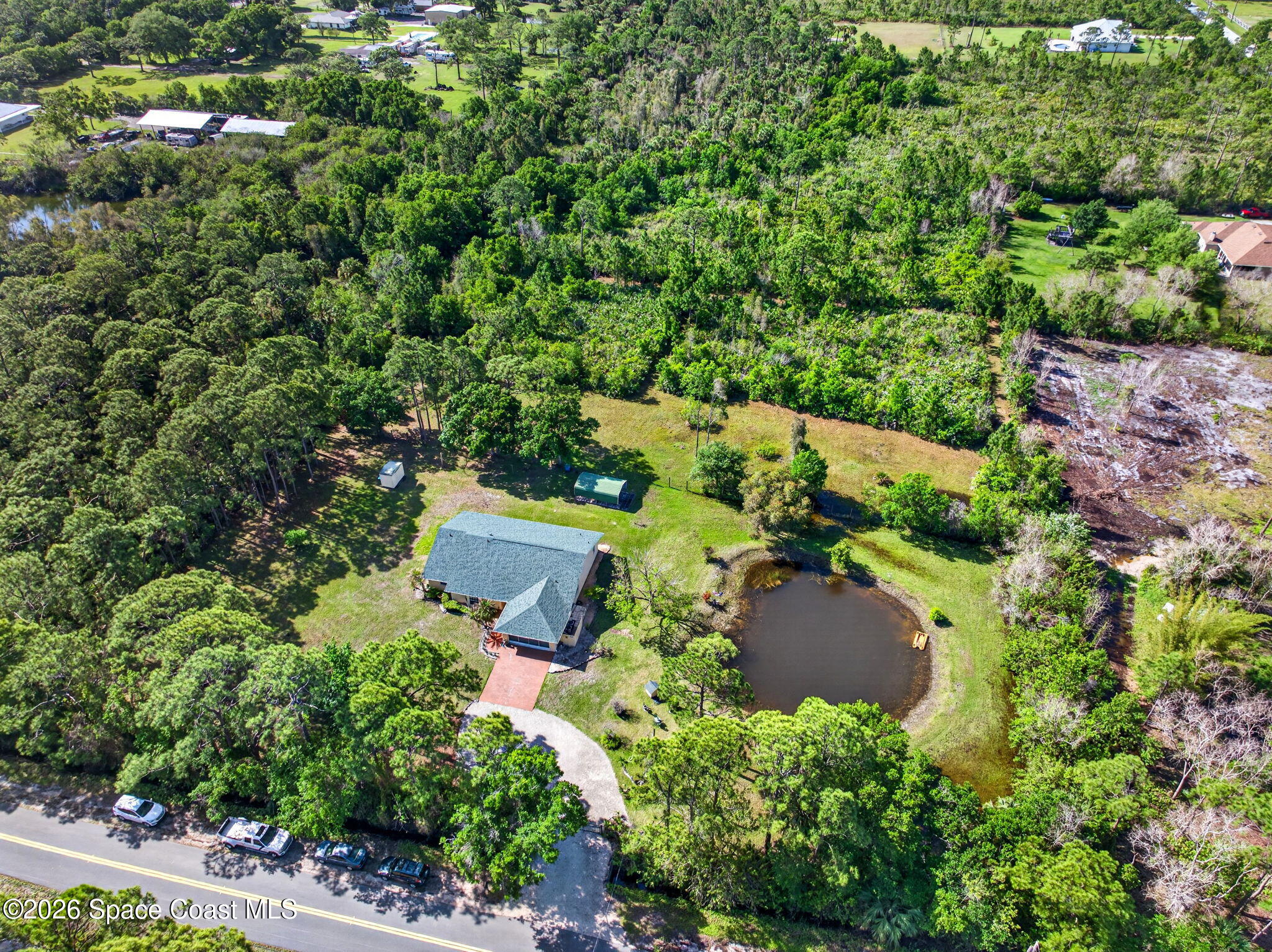 1455 Atz Road Malabar, FL 32950 - Photo 66 of 73 an aerial view of a house with yard