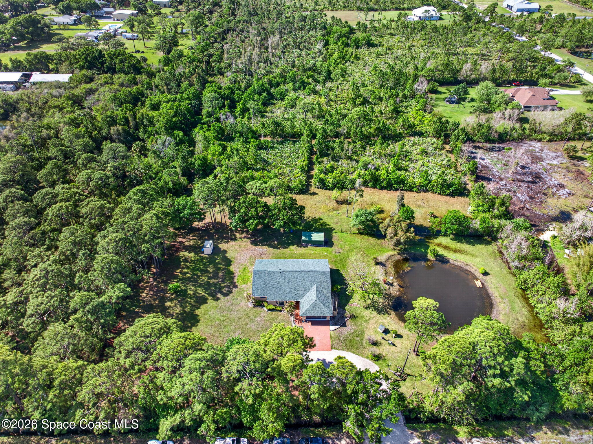 1455 Atz Road Malabar, FL 32950 - Photo 67 of 73 an aerial view of a house with yard