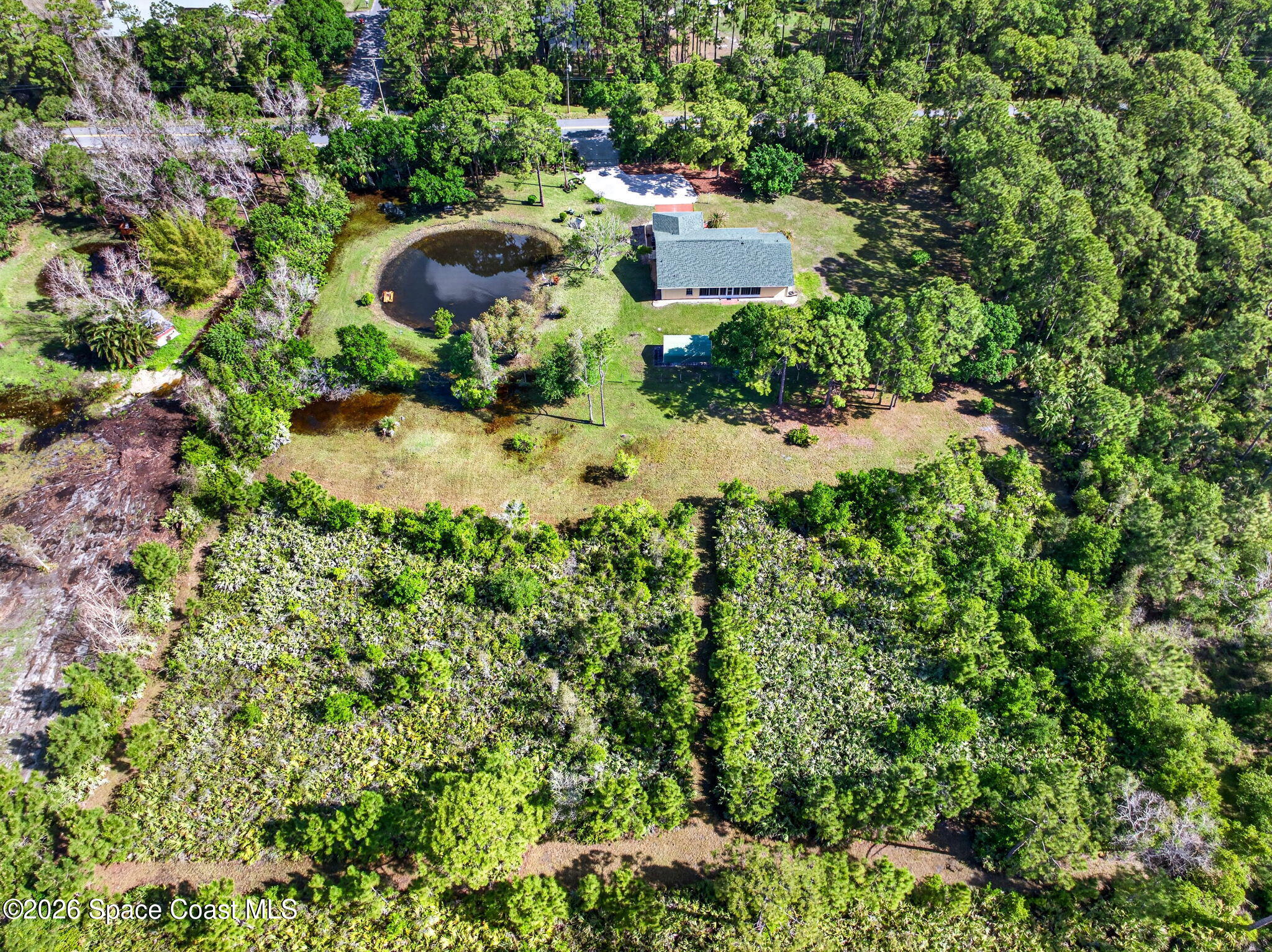 1455 Atz Road Malabar, FL 32950 - Photo 68 of 73 a view of a house with a yard and swimming pool