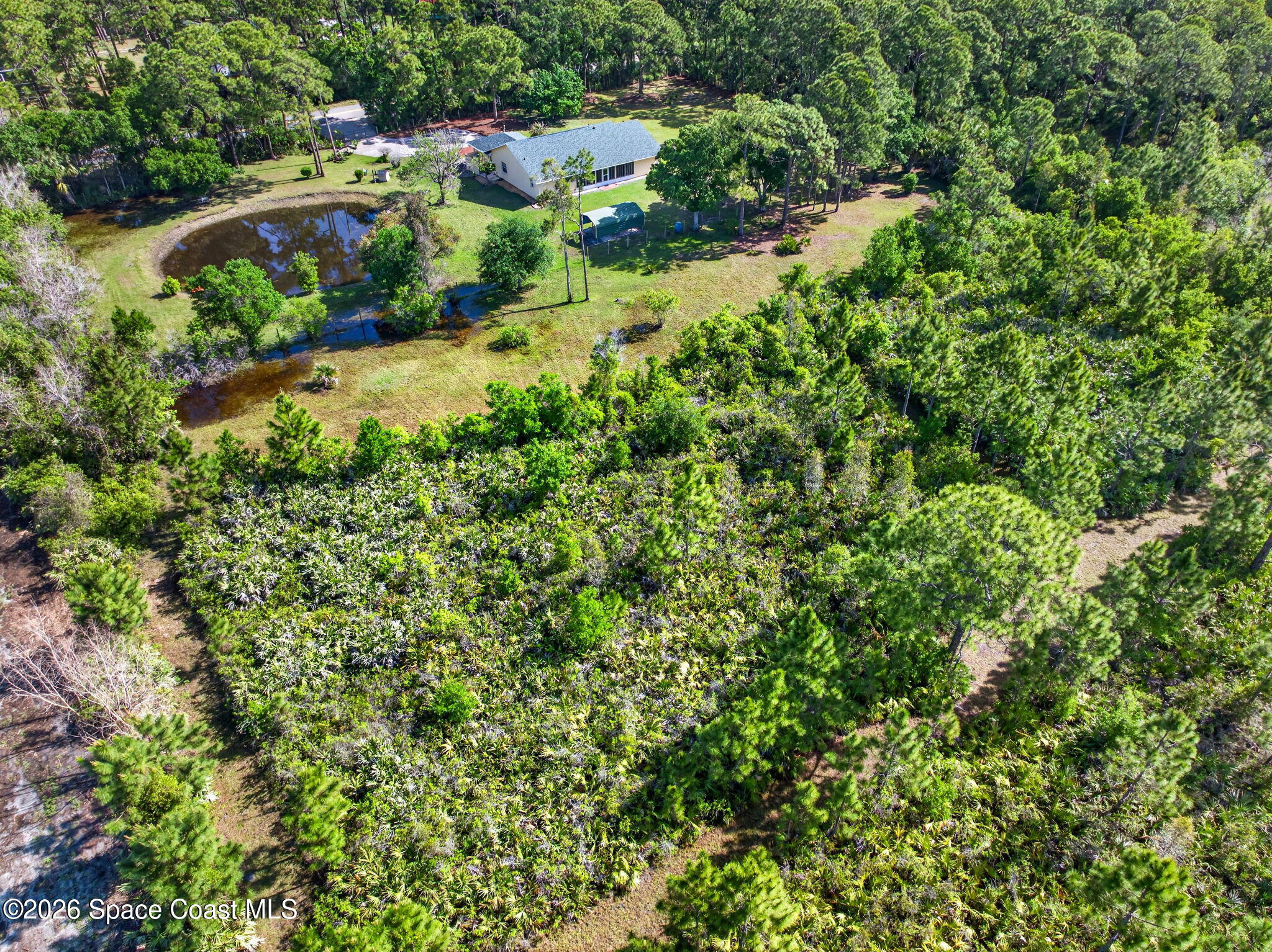 1455 Atz Road Malabar, FL 32950 - Photo 70 of 72 an aerial view of residential house with outdoor space and trees all around