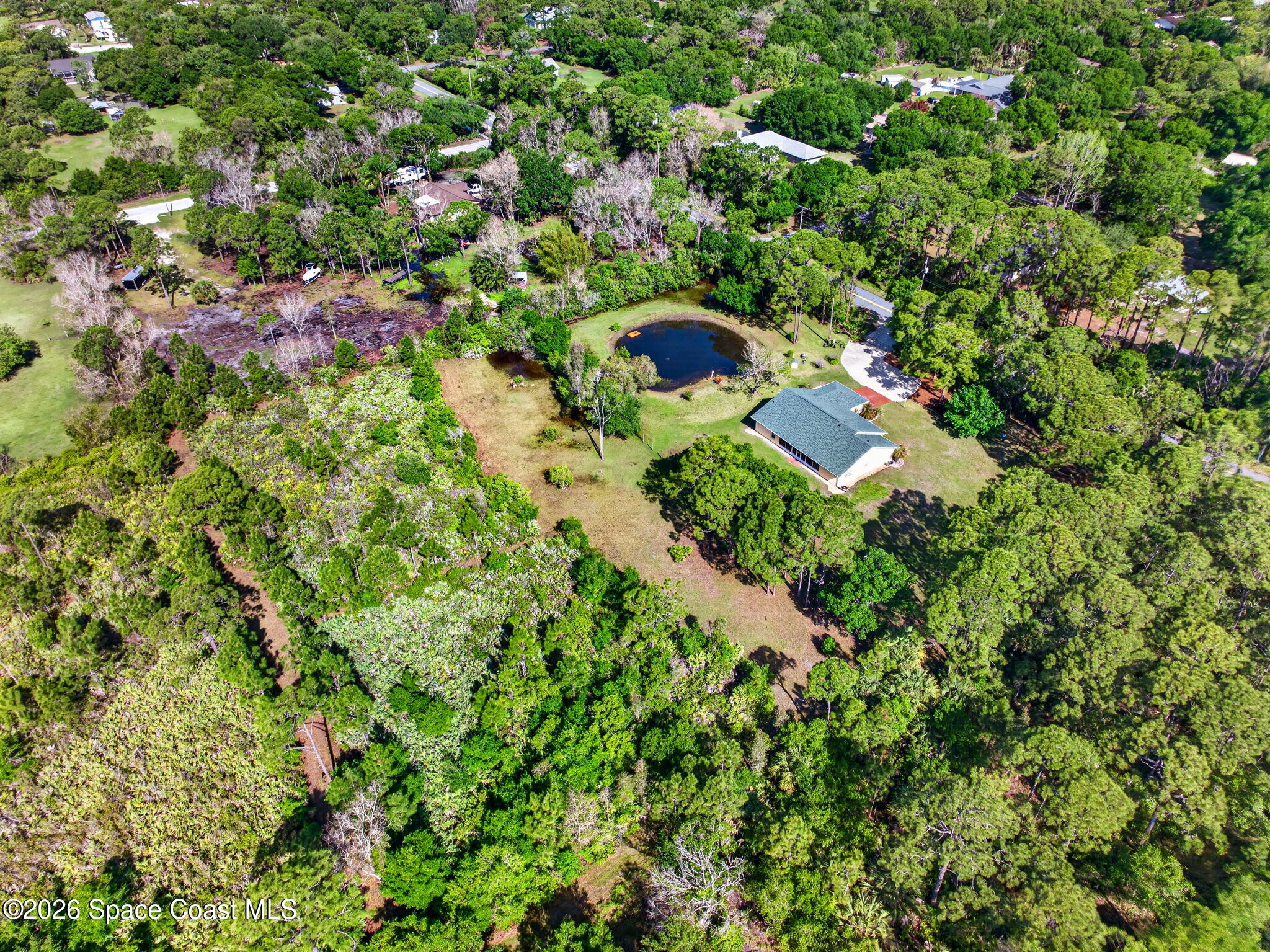 1455 Atz Road Malabar, FL 32950 - Photo 73 of 73 an aerial view of residential house with outdoor space and trees all around