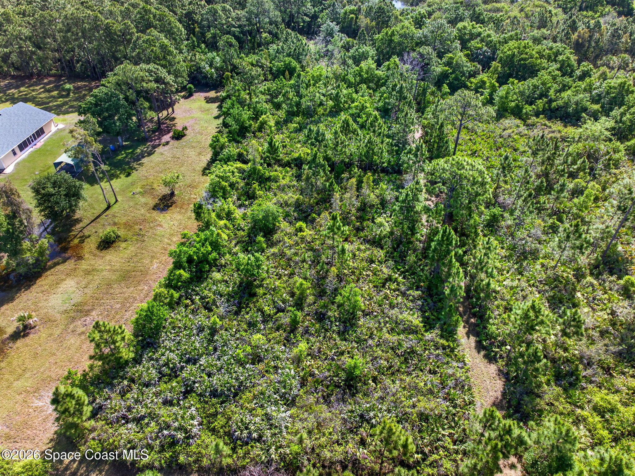 1455 Atz Road Malabar, FL 32950 - Photo 9 of 73 an aerial view of a house with a yard