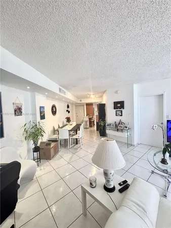a living room with furniture and white walls