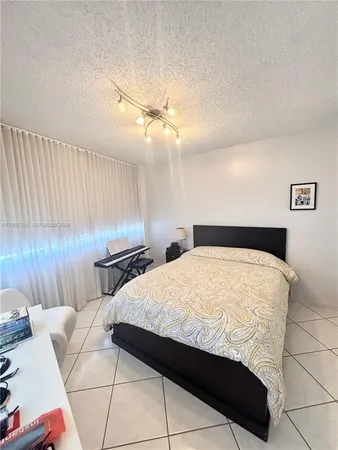 a bedroom with a bed and a cabinets