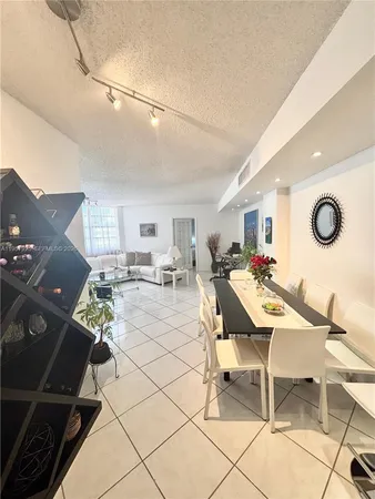 a patio with a table and chairs