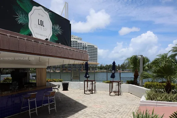 a view of a chairs and table in patio