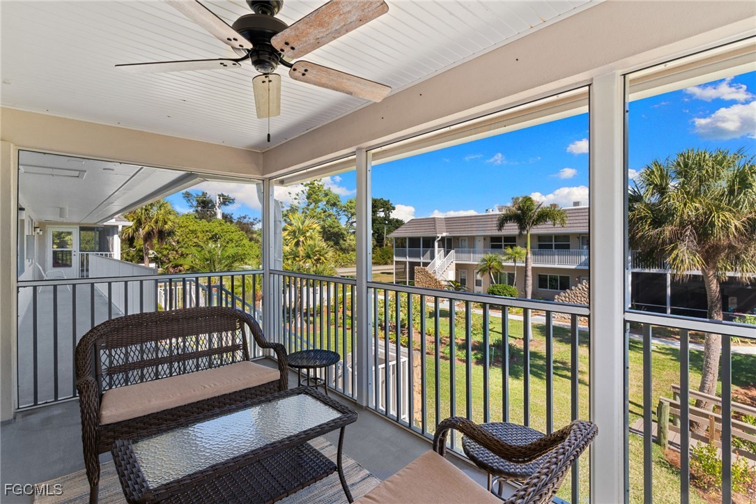 601 Periwinkle Way, Unit C5 Sanibel, FL 33957 - Photo 11 of 35 a view of a porch with furniture