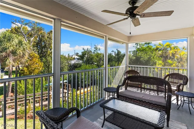 a view of a chairs and fire pit in the balcony