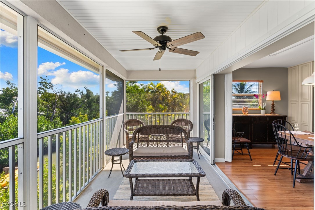 601 Periwinkle Way, Unit C5 Sanibel, FL 33957 - Photo 14 of 35 a view of a chairs and fire pit in the balcony