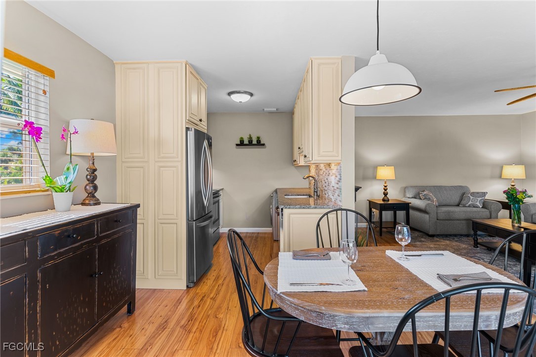 601 Periwinkle Way, Unit C5 Sanibel, FL 33957 - Photo 15 of 35 a view of a dining room with furniture