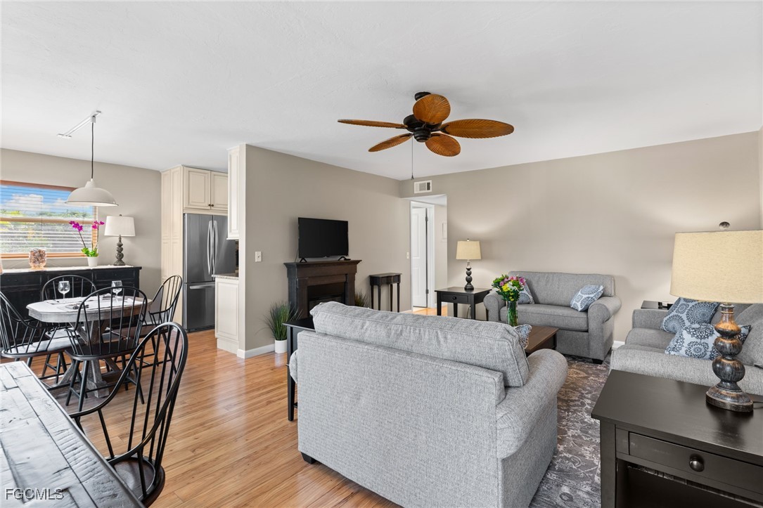 601 Periwinkle Way, Unit C5 Sanibel, FL 33957 - Photo 20 of 35 a living room with furniture and a flat screen tv