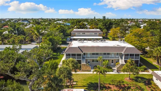 a view of a building with trees in the background