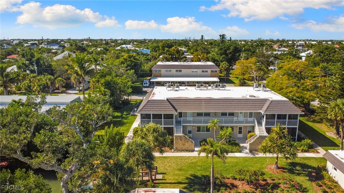 601 Periwinkle Way, Unit C5 Sanibel, FL 33957 - Photo 29 of 35 a view of a city with lawn chairs