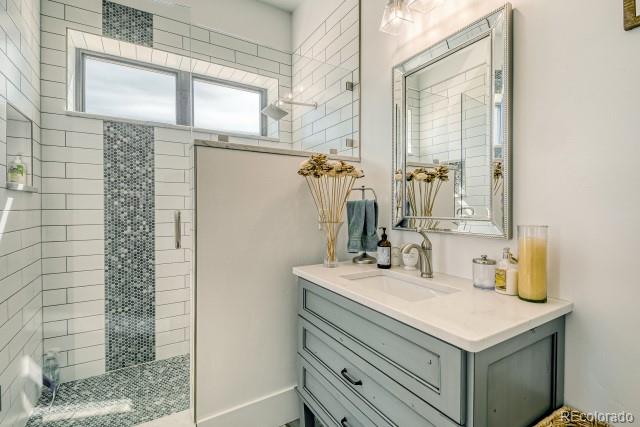 560 Talons Reach Run Berthoud, CO 80513 - Photo 14 of 43 a bathroom with a sink vanity and a mirror