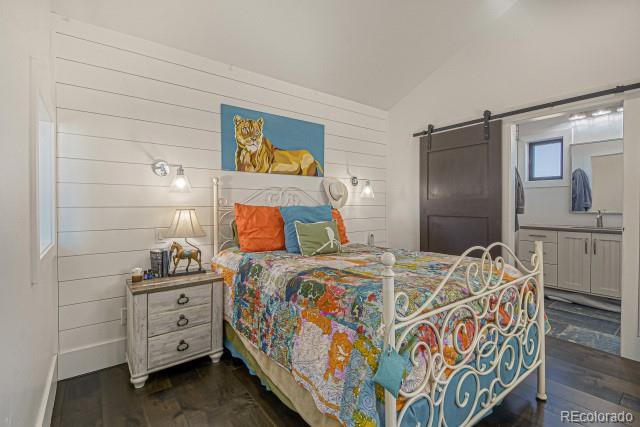 560 Talons Reach Run Berthoud, CO 80513 - Photo 16 of 43 a bedroom with a bed and dresser