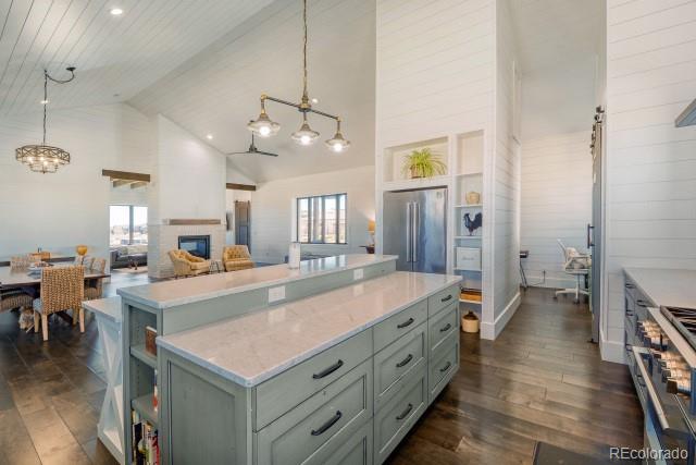560 Talons Reach Run Berthoud, CO 80513 - Photo 6 of 43 an open kitchen with a table and chairs