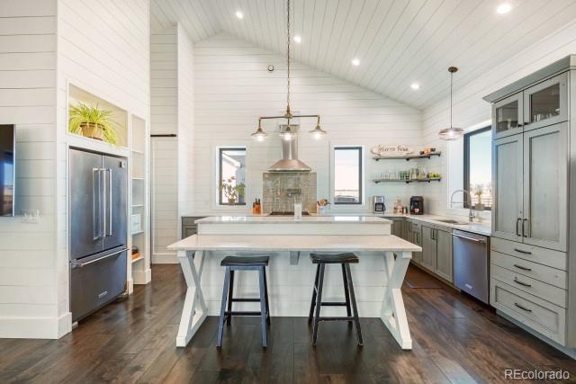 560 Talons Reach Run Berthoud, CO 80513 - Photo 8 of 43 a kitchen with stainless steel appliances a dining table chairs stove and refrigerator