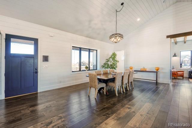 560 Talons Reach Run Berthoud, CO 80513 - Photo 9 of 43 a view of a dining room with furniture window and wooden floor