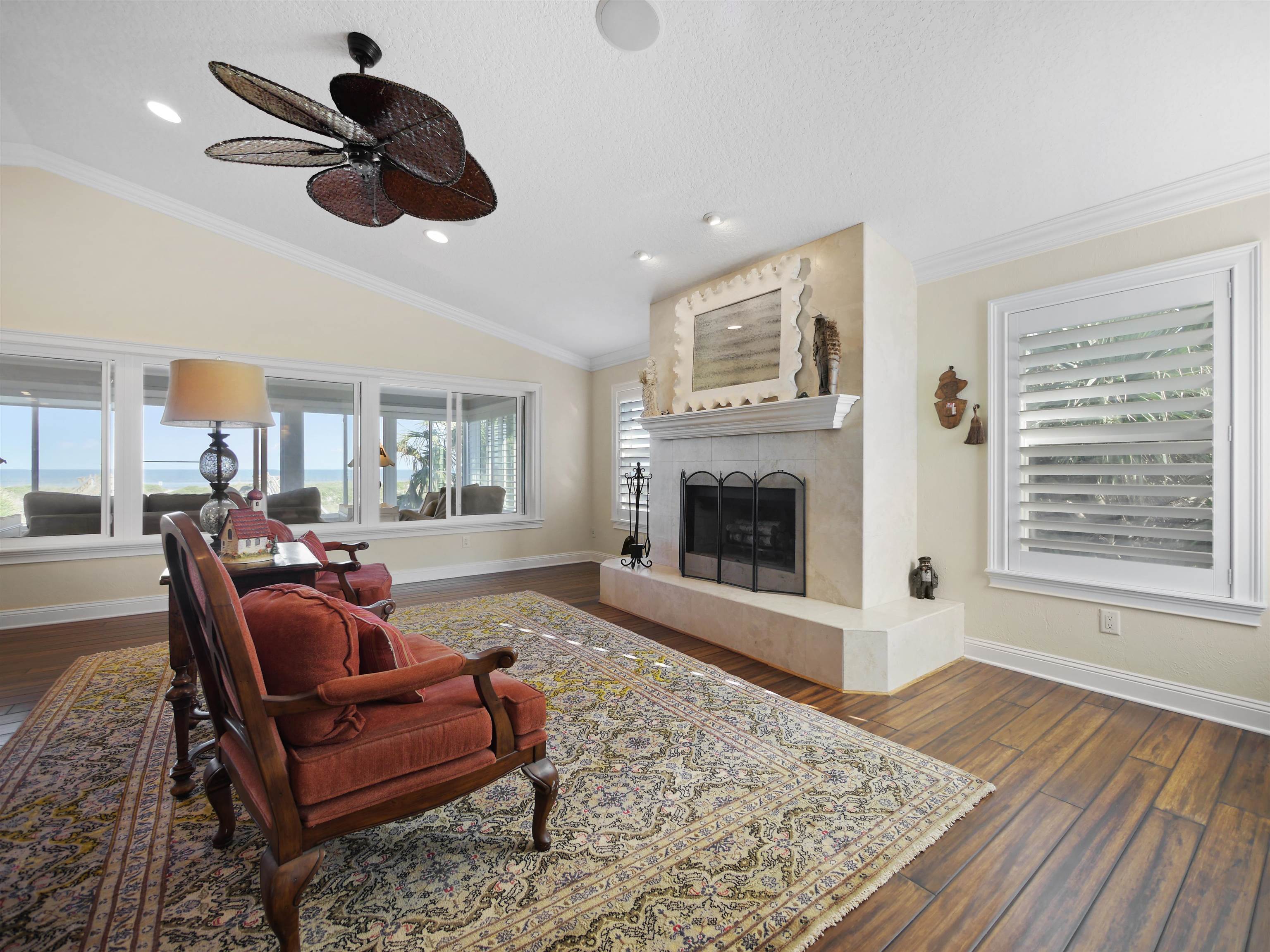 5348 Atlantic View St. Augustine, FL 32080 - Photo 18 of 60 a living room with furniture and a fireplace