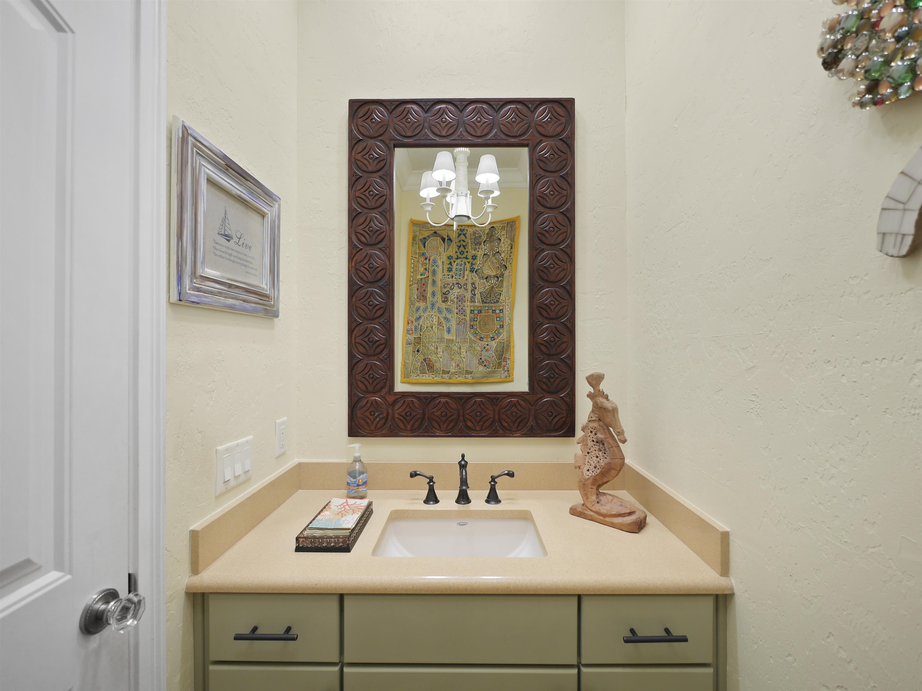 5348 Atlantic View St. Augustine, FL 32080 - Photo 22 of 60 a bathroom with a sink and a mirror