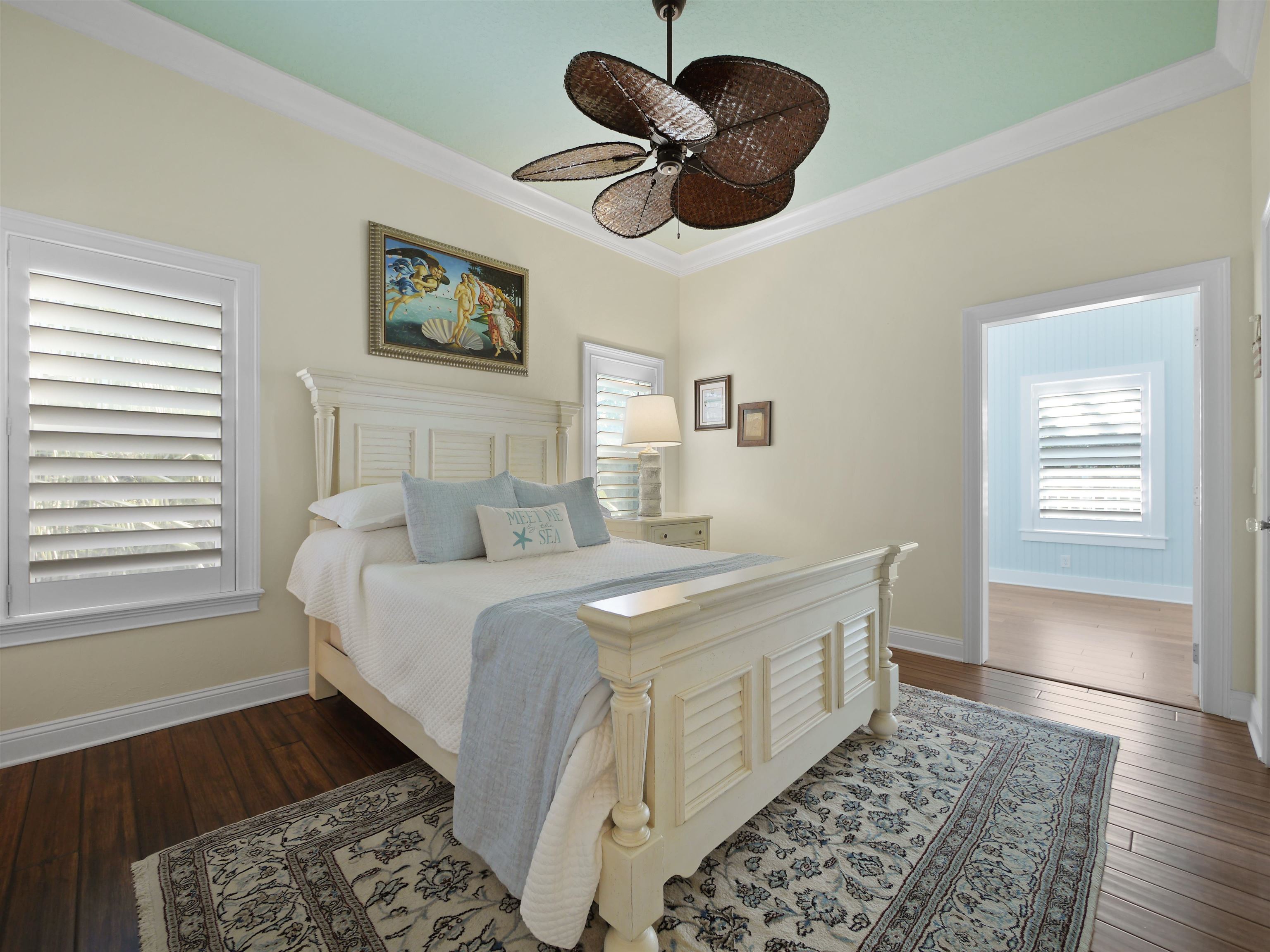 5348 Atlantic View St. Augustine, FL 32080 - Photo 24 of 60 a bedroom with a bed and a chandelier