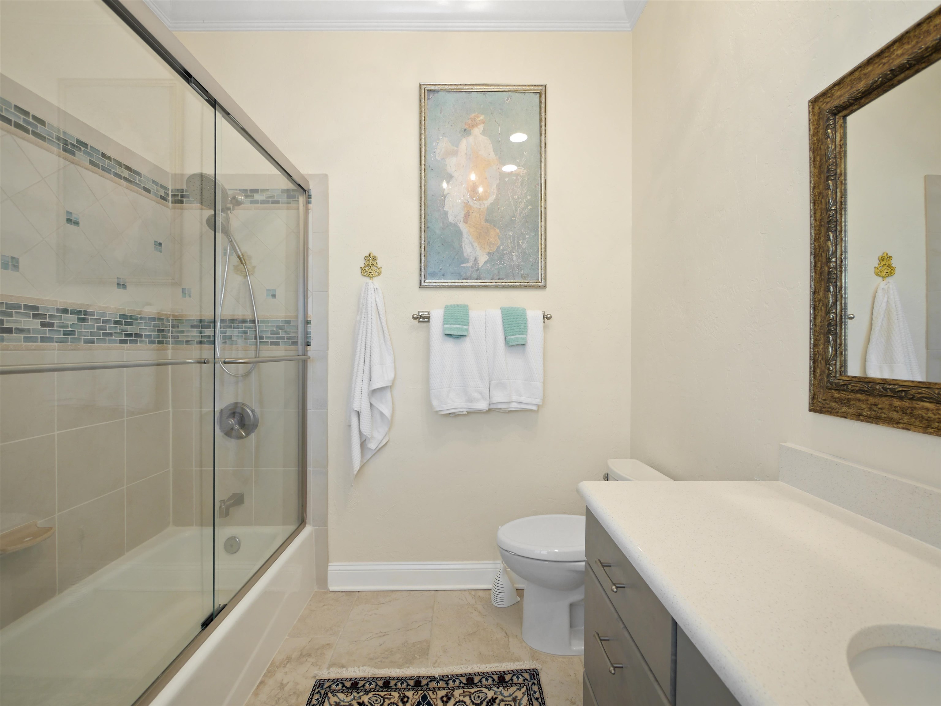 5348 Atlantic View St. Augustine, FL 32080 - Photo 26 of 60 a bathroom with a shower toilet and sink