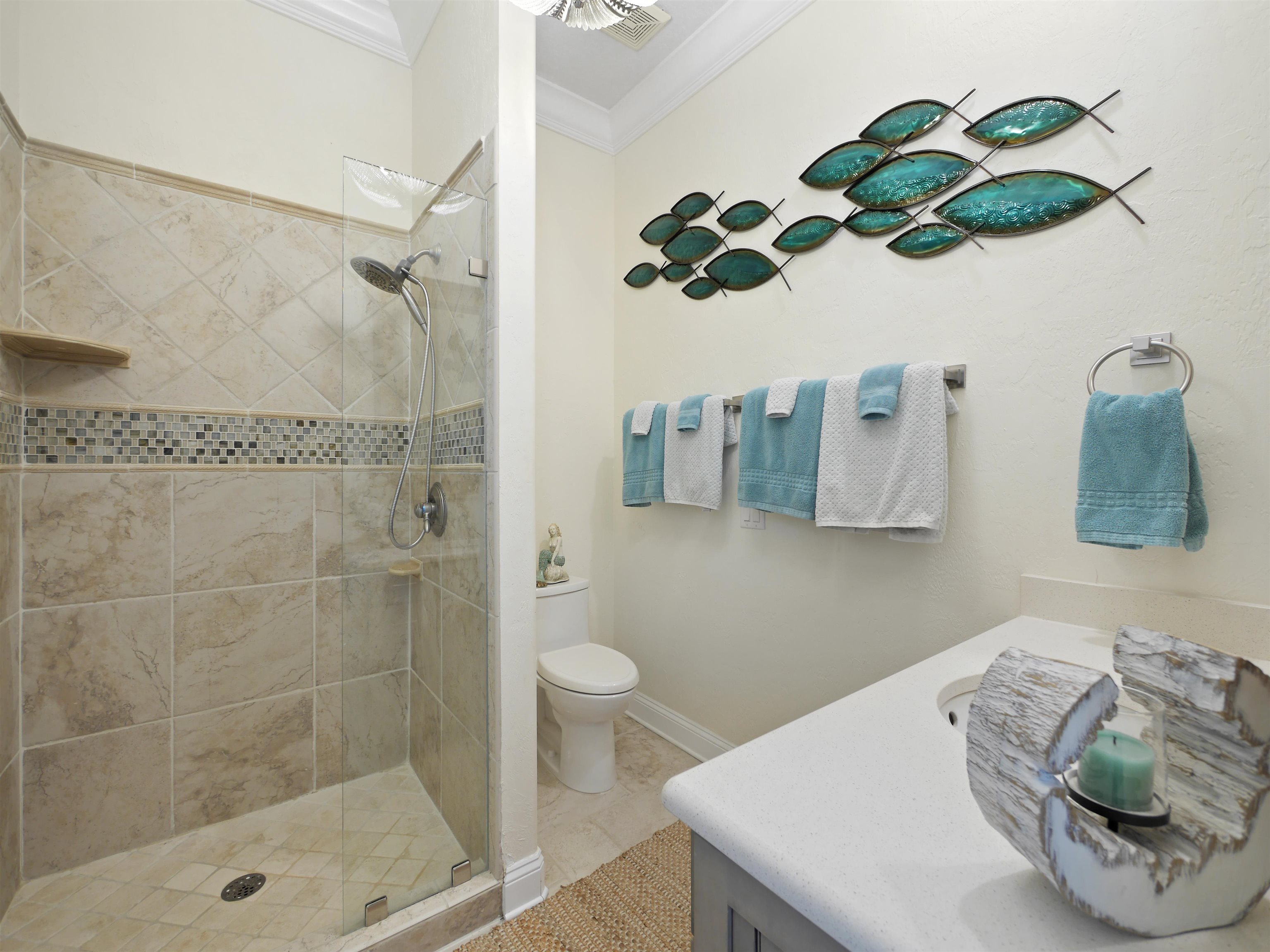 5348 Atlantic View St. Augustine, FL 32080 - Photo 33 of 60 a bathroom with a sink a toilet and shower