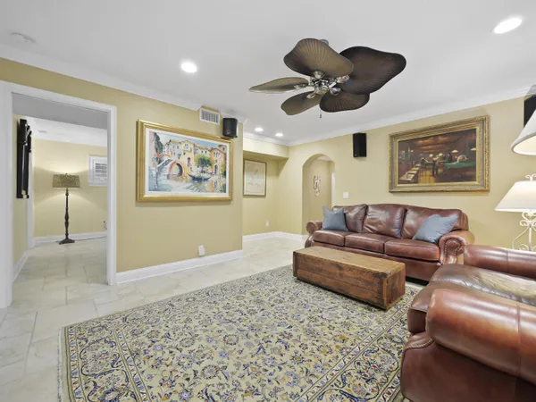 a view of a house with a backyard and trees