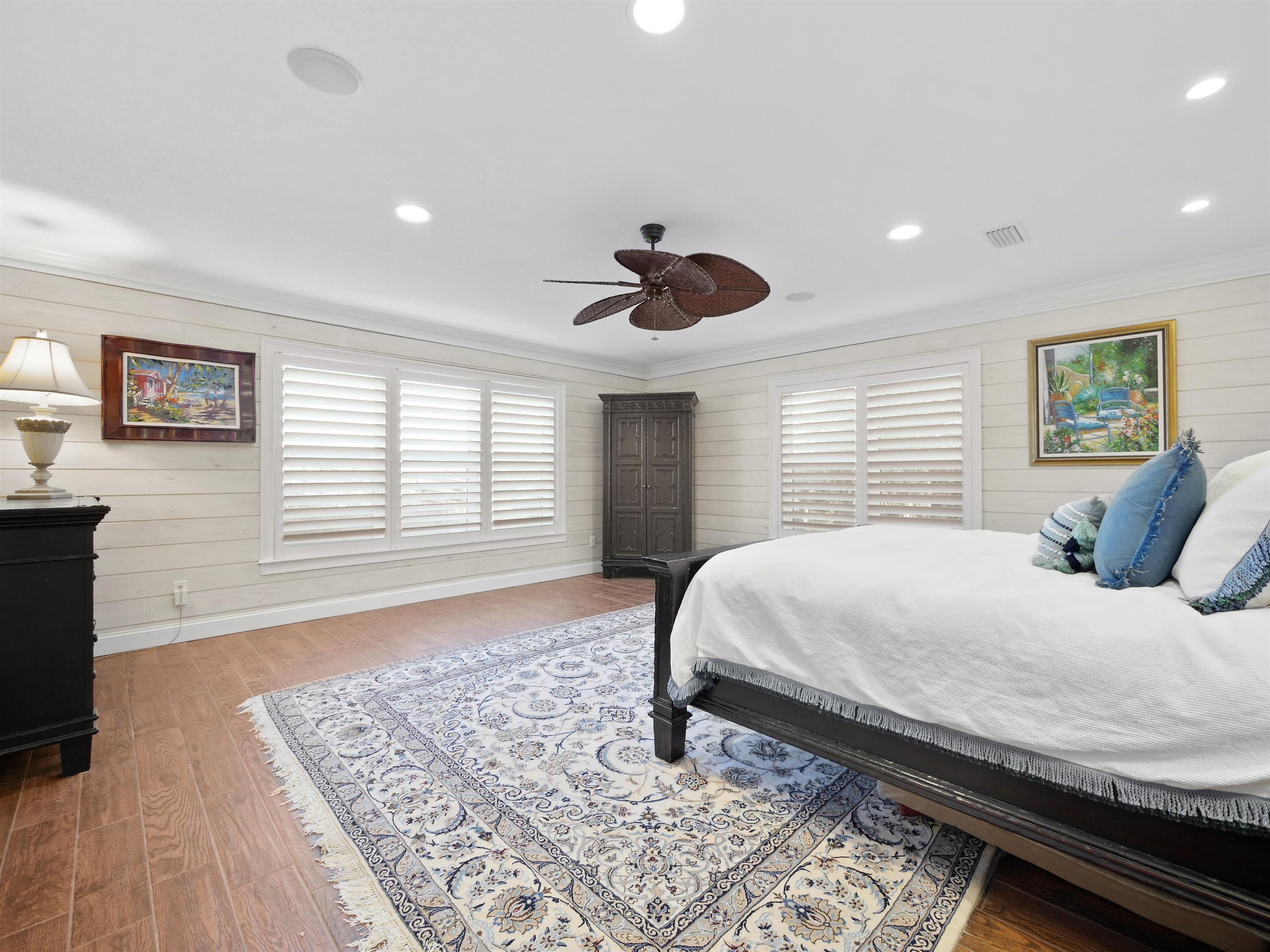 5348 Atlantic View St. Augustine, FL 32080 - Photo 48 of 60 a bedroom with a large bed and a large window