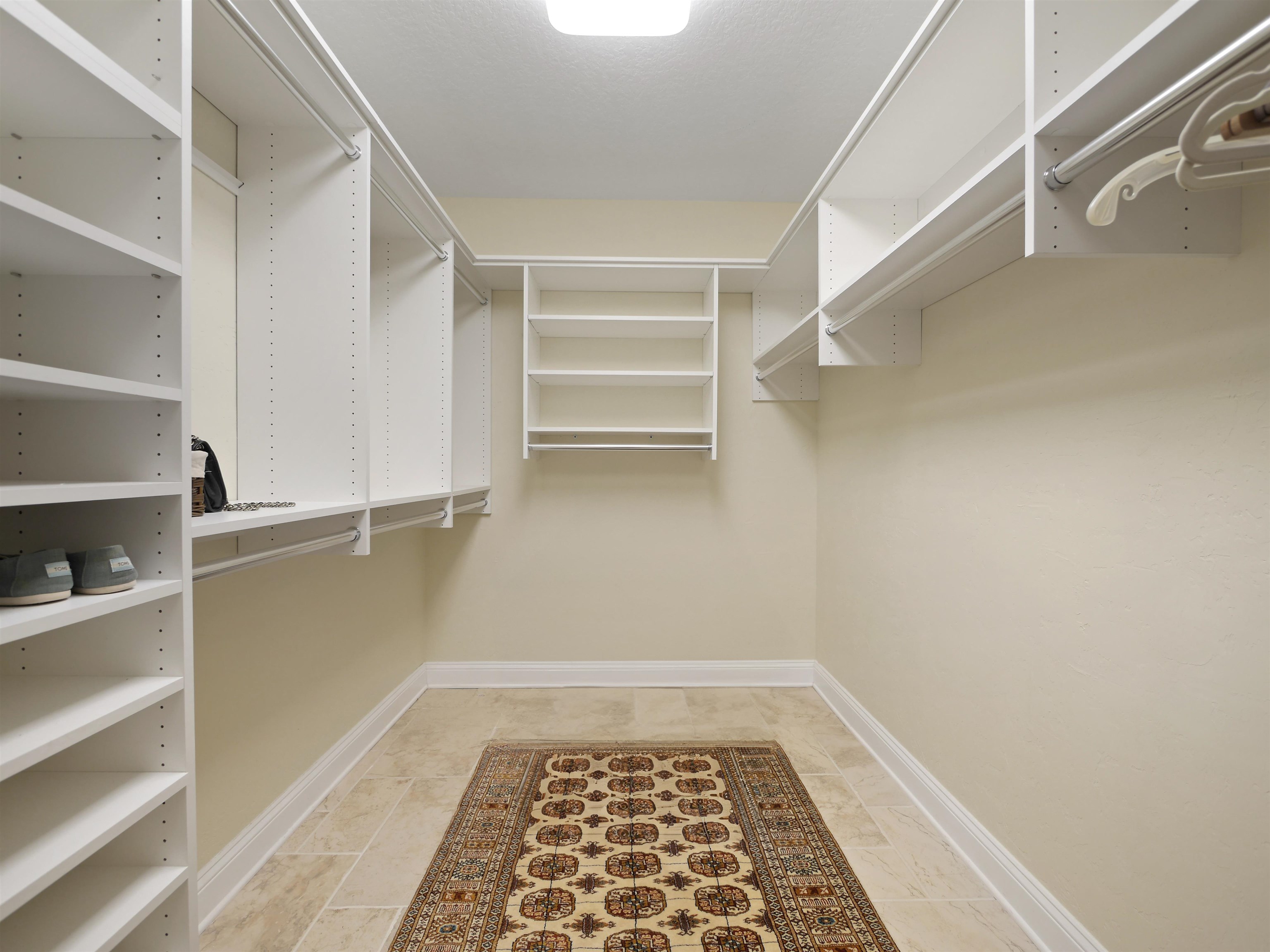 5348 Atlantic View St. Augustine, FL 32080 - Photo 52 of 60 a walk in closet with wooden floor
