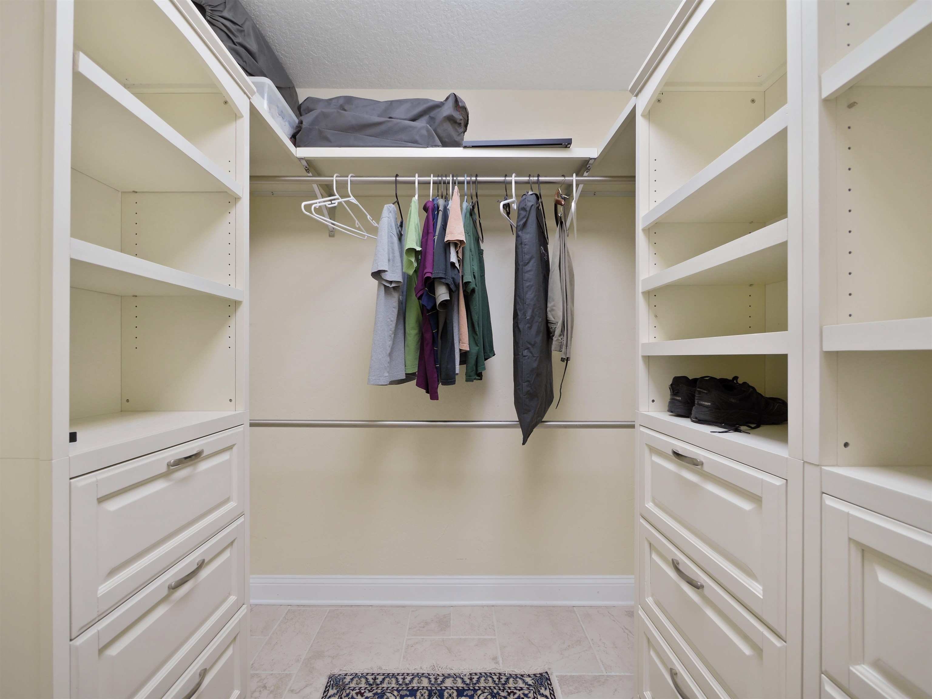 5348 Atlantic View St. Augustine, FL 32080 - Photo 53 of 60 a view of walk in closet with clothes and shoes
