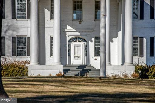 889 Butterfly Lane Frederick, MD 21703 - Photo 2 of 23 a front view of a house with a yard