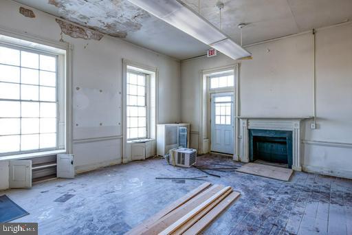 889 Butterfly Lane Frederick, MD 21703 - Photo 12 of 23 a living room with furniture and a fireplace