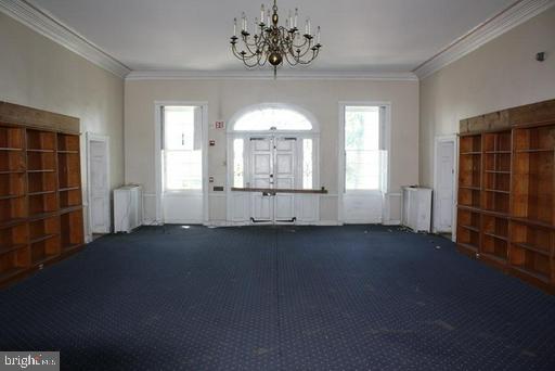 889 Butterfly Lane Frederick, MD 21703 - Photo 14 of 23 an empty room with windows and fan