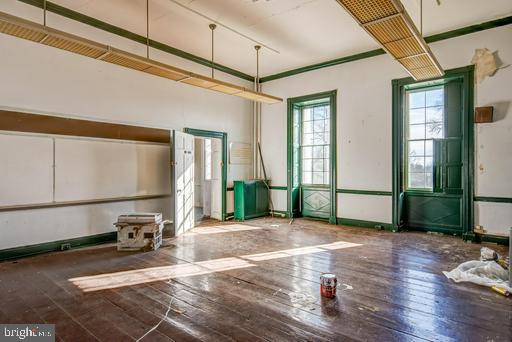 889 Butterfly Lane Frederick, MD 21703 - Photo 18 of 23 a view of a livingroom with wooden floor and windows