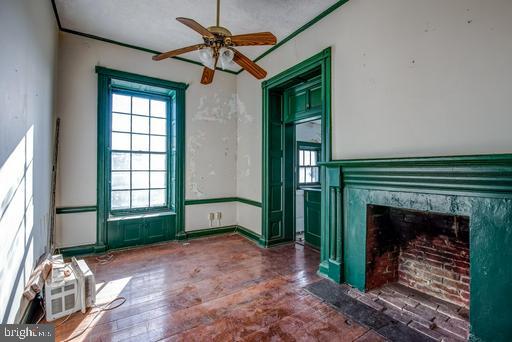 889 Butterfly Lane Frederick, MD 21703 - Photo 20 of 23 a view of an empty room with a fireplace and a window