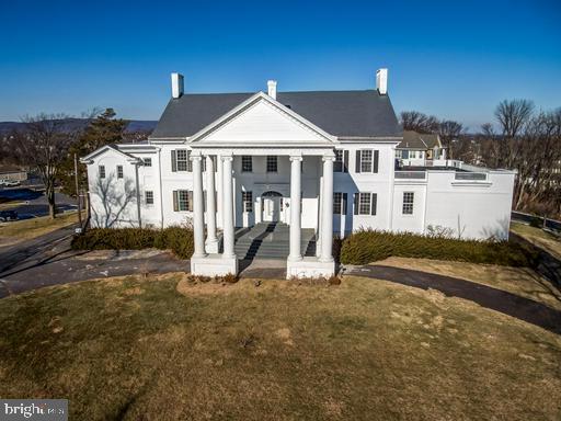 889 Butterfly Lane Frederick, MD 21703 - Photo 3 of 23 a front view of a house with a yard