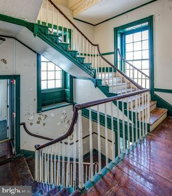 889 Butterfly Lane Frederick, MD 21703 - Photo 23 of 23 a view of staircase with railing and white walls