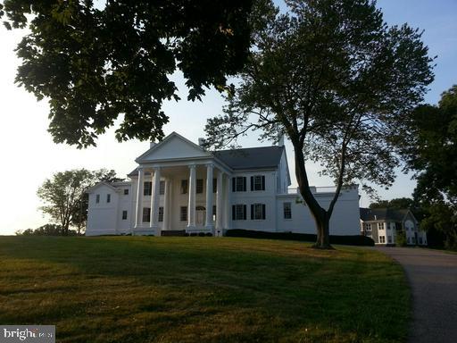889 Butterfly Lane Frederick, MD 21703 - Photo 6 of 23 a front view of a house with a garden