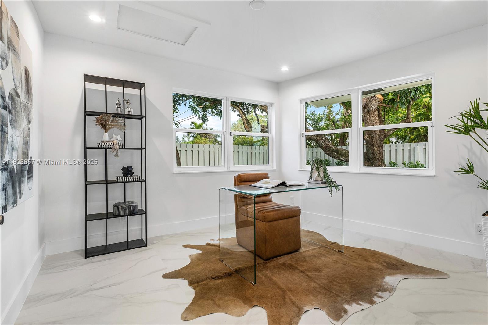 1338 Southwest 13th Street Boca Raton, FL 33486 - Photo 12 of 45 a living room with stainless steel appliances furniture a rug and a window