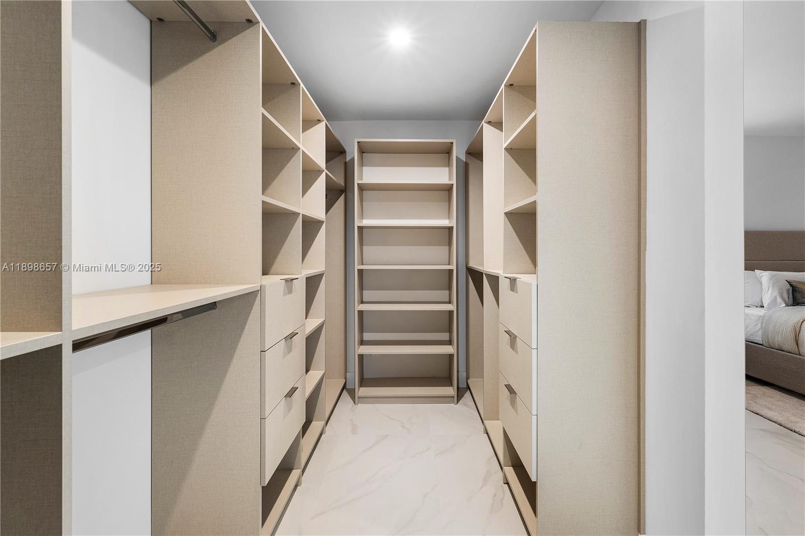 1338 Southwest 13th Street Boca Raton, FL 33486 - Photo 17 of 45 a view of walk in closet with empty racks